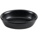 A black oval Hall China baker dish with white background.