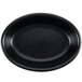 A black oval baker dish with a white background.