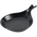 A black china fry pan server with a handle.