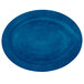 A Lodge cobalt blue oval wood underliner on a table.
