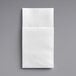 A close-up of a white Touchstone by Choice linen-feel napkin.