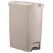 A beige Rubbermaid commercial rectangular trash can with step-on lid.