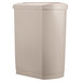 A beige Rubbermaid Slim Jim rectangular trash can with a white surface.