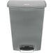 A grey Rubbermaid Slim Jim plastic trash can with a black lid and handle.