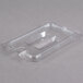 A clear plastic Carlisle container lid with a spoon notch.