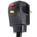 A black electrical plug with yellow and red buttons.