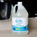 A gallon of Noble Chemical foaming hand sanitizer on a counter.