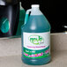 A bottle of Noble Chemical Novo foaming hand soap on a counter.