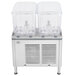 A Crathco refrigerated beverage dispenser with two clear containers with clear lids.