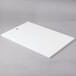 A white rectangular filler plate for a VP545 packaging machine.