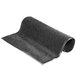 A roll of charcoal gray carpet.