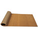 A rolled up brown Cactus Mat natural tan scraper floor roll.