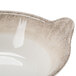 A white melamine bowl with a brown crackle-finished border and side handles.