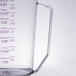 A purple Cambro polycarbonate measuring cup with a handle and measuring scale.