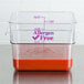 A Cambro clear square polycarbonate food storage container with a lid that says allergen free containing red liquid.