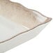 A white rectangular melamine tray with a scalloped brown trim.