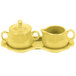 A yellow ceramic sugar and creamer tray set with a lid and pitcher.