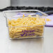 A Cambro clear plastic container with pasta in it.