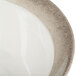 A white melamine bowl with a brown crackle-finished border.