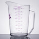 A clear Cambro measuring cup with a purple allergen-free measuring scale.