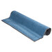 A roll of blue carpet with white packaging.