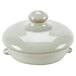 A white ceramic Tuxton Tea Pot lid.