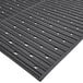 A black Nitrile rubber mat with perforations.