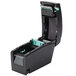 A black and green Tor Rey DT-2 Price Computing thermal label printer.
