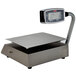 A Tor Rey PC-40LT legal for trade digital scale on a metal stand with a screen.