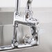 An Equip by T&S chrome add-on faucet with a metal handle.