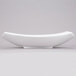 An American Metalcraft oval stoneware bowl with a curved edge on a white surface.