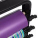 A purple roll of paper on a black Bulman countertop rack.