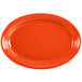A white china oval platter with orange accents.