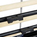 A black Bulman countertop rack with three rods.