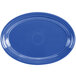 A blue oval china platter with a white background.