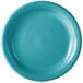 A close-up of a turquoise Fiesta® appetizer plate with a ring of circles on the rim.