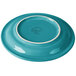 A close-up of a Fiesta® turquoise appetizer plate with a white rim.