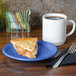 A slice of apple pie on a Fiesta® Lapis China plate with a cup of coffee.