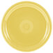 A yellow plate with a circular pattern.