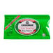 A green Kikkoman packet of less sodium soy sauce.