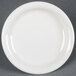 A white Fiesta® dinnerware appetizer plate with a rim on a grey surface.