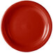 A close-up of a Scarlet red Fiesta® china appetizer plate with a rim and a circle in the middle.