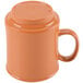 A close-up of a GET Diamond Harvest pumpkin mug with a brown handle.