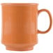An orange GET pumpkin mug with a handle.