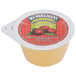 A close up of a small container of Musselman's unsweetened apple sauce.