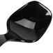 A black plastic Fineline serving spoon with a handle.