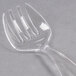 A close-up of a clear plastic Fineline Serving Fork.