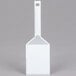 A white plastic spatula with a white handle.