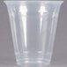 A clear plastic Dart Conex cold cup with a lid.