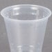 A Dart ClearPro clear plastic cup on a gray surface.